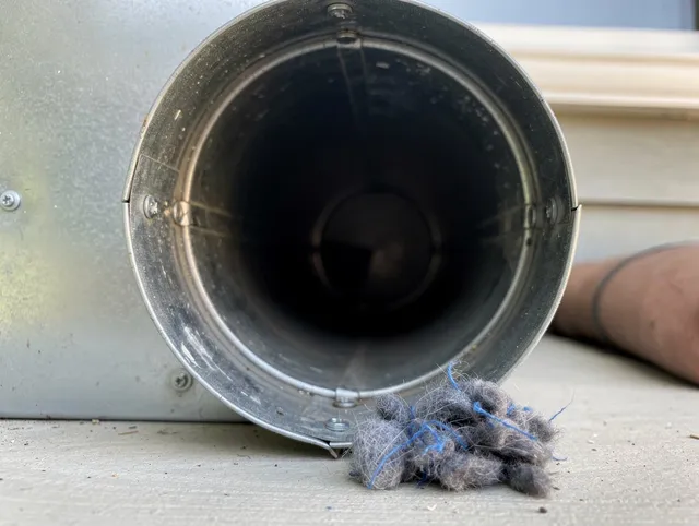 Rosemead Dryer Vent Cleaning technician using specialized equipment to clear severe dryer vent blockage in Rosemead